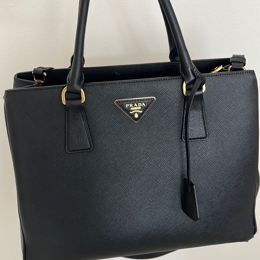 Prada top handle bag with strap.  A little bit scuffed in 2 areas and handle
